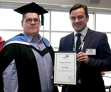 Ian watson receiving award